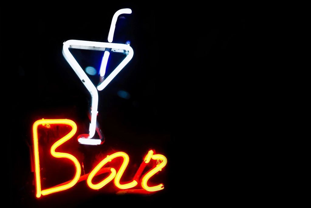 A cocktail being finished at the bar