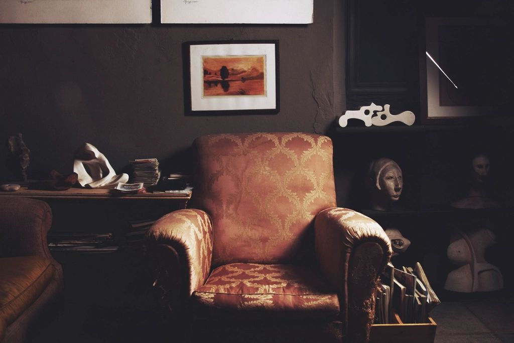 A suite sitting room with a sofa and armchairs